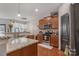 Well-lit kitchen featuring stainless steel appliances and granite countertops at 8031 Scarlet Oak Ter, Indian Land, SC 29707