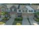 View of attractive townhomes with attached garages and well-maintained landscaping at 8031 Scarlet Oak Ter, Indian Land, SC 29707