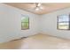 Neutral bedroom featuring two windows and a ceiling fan for ample natural light at 804 Gw Broome Rd, Monroe, NC 28112