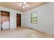 Neutral bedroom featuring a closet and a window for ample natural light at 804 Gw Broome Rd, Monroe, NC 28112