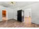 Dining room with vinyl floors, white walls, and access to other rooms in the home at 804 Gw Broome Rd, Monroe, NC 28112
