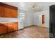 Kitchen features white tiled backsplash, white appliances, and beautiful wood cabinetry at 804 Gw Broome Rd, Monroe, NC 28112
