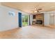 Spacious living room with a brick fireplace, sliding glass door, and ceiling fan at 804 Gw Broome Rd, Monroe, NC 28112