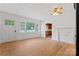 Inviting living room with hardwood floors, fireplace and abundant natural light through large windows at 804 Gw Broome Rd, Monroe, NC 28112