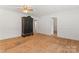 Bright living room boasts hardwood floors, neutral paint, and an antique armoire at 804 Gw Broome Rd, Monroe, NC 28112