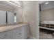 Bathroom featuring large mirror over single sink vanity with granite countertops at 8701 Highgrove St, Charlotte, NC 28277