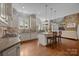 Beautiful kitchen with an island, modern appliances, and open layout to the living room at 8701 Highgrove St, Charlotte, NC 28277
