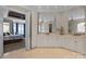 Main bathroom with double vanity, large mirror, and access to the main bedroom at 8701 Highgrove St, Charlotte, NC 28277