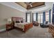 Spacious main bedroom with tray ceilings, plush carpet, and ample natural light at 8701 Highgrove St, Charlotte, NC 28277