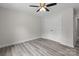 Bedroom features gray wood-look floors, neutral walls, and a closet at 894 Oval St, Kannapolis, NC 28081
