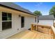 New wooden deck off the rear of a home with white siding and a black roof on a partly cloudy day at 894 Oval St, Kannapolis, NC 28081