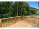 New wooden deck with a view of a treed back lot at 894 Oval St, Kannapolis, NC 28081