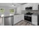 Stylish kitchen featuring stainless steel appliances, granite countertops, and white cabinets at 894 Oval St, Kannapolis, NC 28081