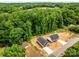 Aerial view of new homes surrounded by lush greenery and trees in a quiet neighborhood at 896 Oval St, Kannapolis, NC 28081