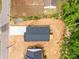 Birds eye view of a new house with a long driveway surrounded by a partially wooded lot at 896 Oval St, Kannapolis, NC 28081