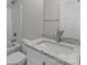 Bathroom featuring a white vanity with granite countertop, toilet, and shower-tub combo at 896 Oval St, Kannapolis, NC 28081