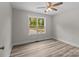 Bright bedroom with a ceiling fan and large window at 896 Oval St, Kannapolis, NC 28081
