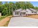 Charming single-story home with a wide concrete driveway and a welcoming front porch at 896 Oval St, Kannapolis, NC 28081