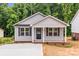 Charming single-story home featuring a covered porch and a well-manicured front yard at 896 Oval St, Kannapolis, NC 28081