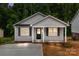 Inviting single-Gathering home with a cozy front porch and a freshly paved driveway at 896 Oval St, Kannapolis, NC 28081