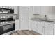 Close-up on the stainless steel stove and granite countertops in the kitchen at 896 Oval St, Kannapolis, NC 28081