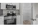 Pantry and stainless steel stove appliances and granite countertops in kitchen at 896 Oval St, Kannapolis, NC 28081