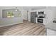 Modern kitchen open to the living room featuring stainless steel appliances and granite countertops at 896 Oval St, Kannapolis, NC 28081