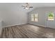 Spacious living room with lots of natural light, ceiling fan and a door to the outside at 896 Oval St, Kannapolis, NC 28081