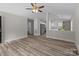 Open-concept living room featuring hardwood floors and a ceiling fan at 896 Oval St, Kannapolis, NC 28081
