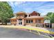 Community clubhouse with large windows and ample parking in front at 9157 Snow Hill Ct, Charlotte, NC 28269