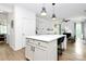 Spacious kitchen with island seating, stainless appliances, and an open layout to the living area at 9157 Snow Hill Ct, Charlotte, NC 28269
