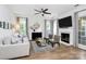 Bright living area with fireplace, neutral decor, and hardwood floors; perfect for relaxation at 9157 Snow Hill Ct, Charlotte, NC 28269