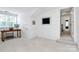 Bright office space with sleek desk, perfect for working from home, and well-lit with natural light from a large window at 9157 Snow Hill Ct, Charlotte, NC 28269