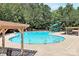 Large community pool with a slide and plenty of seating for residents at 9157 Snow Hill Ct, Charlotte, NC 28269
