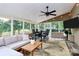 Spacious sunroom featuring ample seating and large windows with an inviting atmosphere for relaxation and entertainment at 9157 Snow Hill Ct, Charlotte, NC 28269