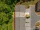 Aerial view shows the roofline and surrounding landscaping of an attractive multi-unit residence at 9203 Grand Valley Dr, Charlotte, NC 28213