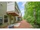 Exterior view of the back of the building with green siding and wooden decks at 9203 Grand Valley Dr, Charlotte, NC 28213