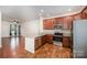 Well-lit kitchen showcases stainless steel appliances, granite countertops, and seamlessly connects to an adjacent living area at 9203 Grand Valley Dr, Charlotte, NC 28213