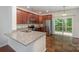Modern kitchen with stainless steel appliances, granite countertops, and sliding glass doors to the outside deck at 9203 Grand Valley Dr, Charlotte, NC 28213