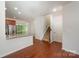 Open kitchen boasts granite countertops, stainless steel appliances, and a seamless transition to the outdoor deck at 9203 Grand Valley Dr, Charlotte, NC 28213