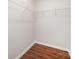 Empty walk-in closet featuring wood floors and wire shelving for ample storage options at 9203 Grand Valley Dr, Charlotte, NC 28213