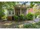 Spacious backyard featuring mature landscaping and a stone pathway at 1139 S Belvedere Ave, Gastonia, NC 28054