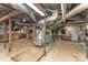 Unfinished basement with exposed brick, wooden beams, and ductwork at 1139 S Belvedere Ave, Gastonia, NC 28054