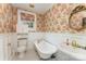 Elegant bathroom with clawfoot tub, unique wallpaper, and a classic sink at 1139 S Belvedere Ave, Gastonia, NC 28054