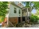 Exterior rear showing brick foundation, screened in porch and white siding at 1139 S Belvedere Ave, Gastonia, NC 28054