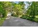 Beautiful home featuring a well-maintained lawn, mature trees, and long driveway at 1139 S Belvedere Ave, Gastonia, NC 28054