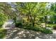 Charming two-story home with manicured landscaping, mature trees, and an inviting facade at 1139 S Belvedere Ave, Gastonia, NC 28054