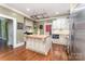 Updated kitchen with a butcher block island, stainless steel appliances, and custom cabinetry at 1139 S Belvedere Ave, Gastonia, NC 28054