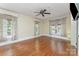Spacious living room with hardwood floors and multiple windows, inviting natural light at 1139 S Belvedere Ave, Gastonia, NC 28054