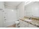 Bright bathroom features granite counters, white cabinets, tub with shower at 11530 Galashiels Dr, Huntersville, NC 28078